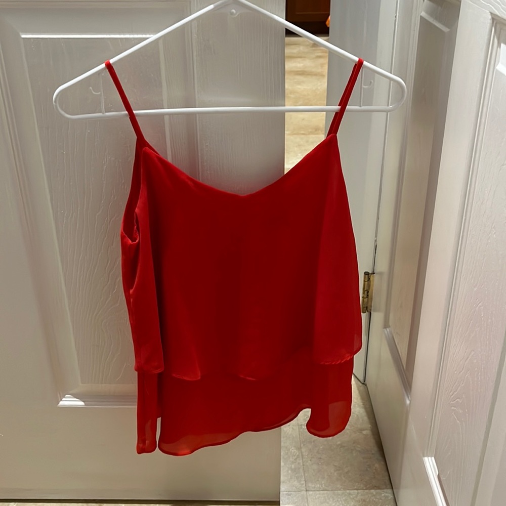 Cute layered tank with cross cross detail in the back!